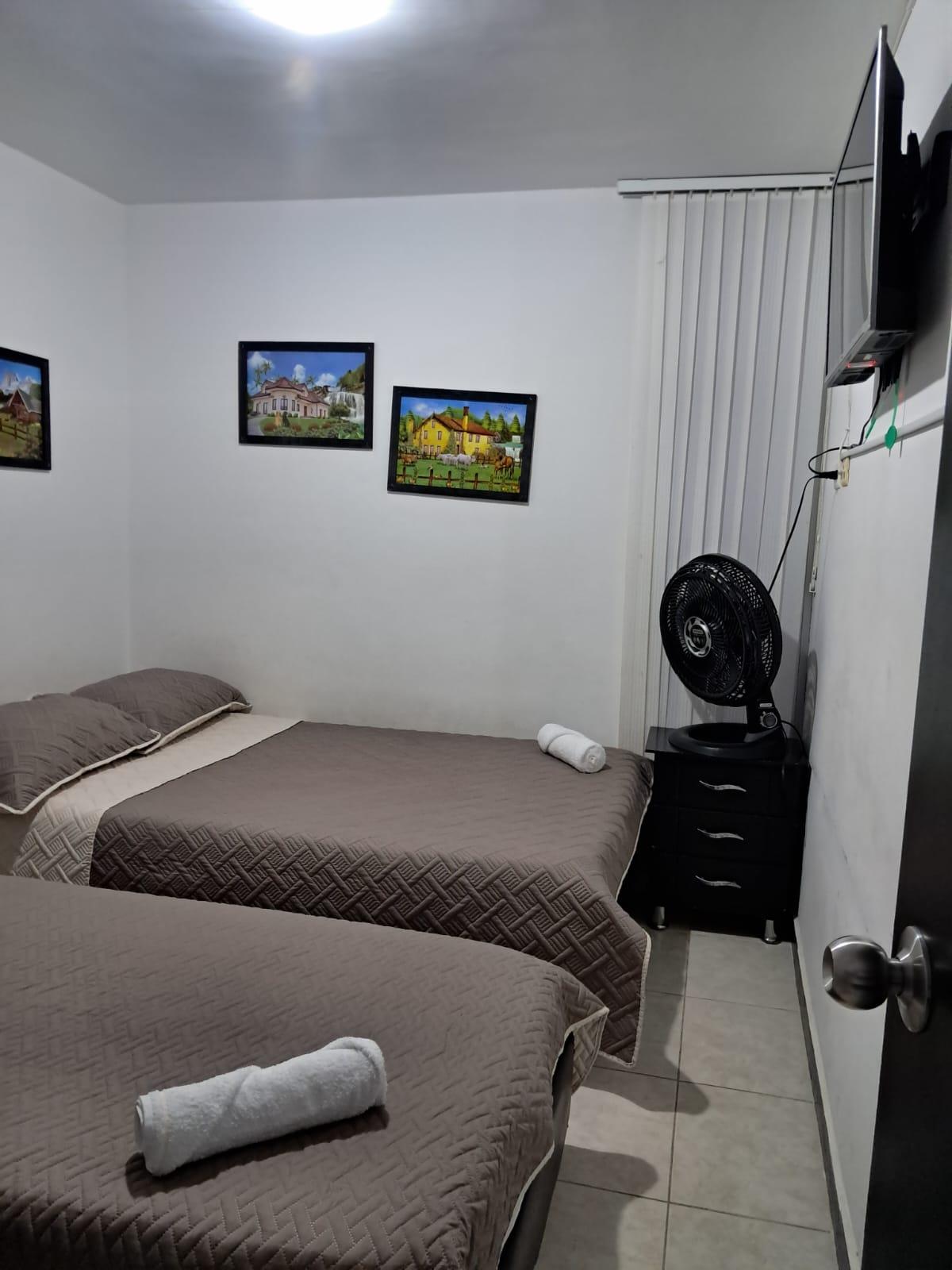 Habitación doble con camas individuales en apartamento El Rincón del Café en Montenegro